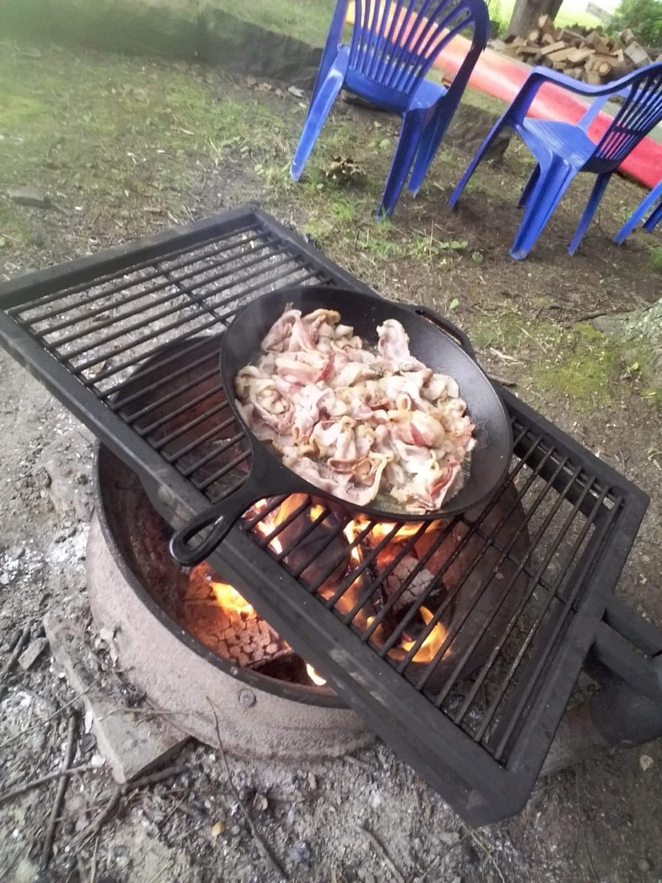 Campfire grill - large skillet - Top view. Bacon.